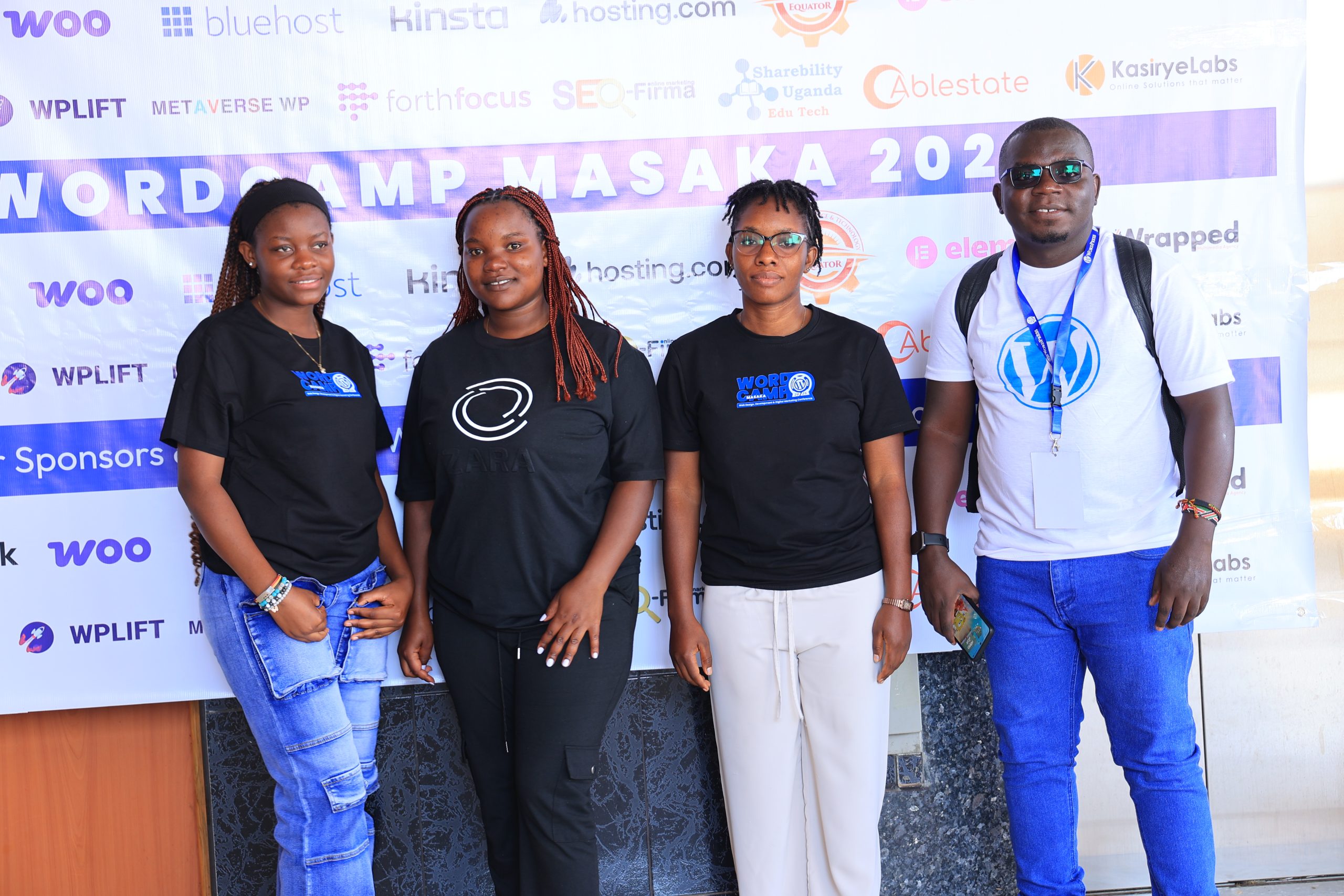 Attendees taking a group photo at WordCamp Masaka 2025